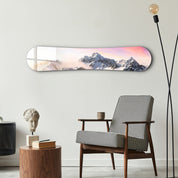 Sunrise Alpine Peaks snowboard-themed glass wall art by Artdesigna, featuring mountain silhouette and vibrant sky scene.