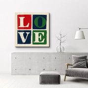 Retro square glass wall art featuring "Love Blocks" typography by Artdesigna, with colorful geometric design on clear glass.