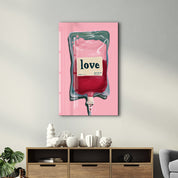 Glass wall art titled Love Transfusion by Artdesigna featuring vibrant pop surreal minimalism design on clear glass.