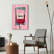Glass wall art titled Love Transfusion by Artdesigna featuring vibrant, surreal pop minimalism on clear glass backlit background.