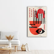 Glass wall art featuring Yayoi Kusama's abstract face design in vibrant Japanese pop art style by Artdesigna.