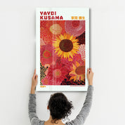 Yayoi Kusama Sunflower Reverie glass wall art by Artdesigna, featuring vibrant sunflower design on clear glass background.