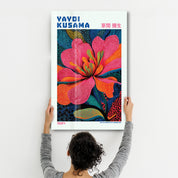 Yayoi Kusama Electric Blossom glass wall art by Artdesigna featuring vibrant, colorful floral design on clear glass panel.