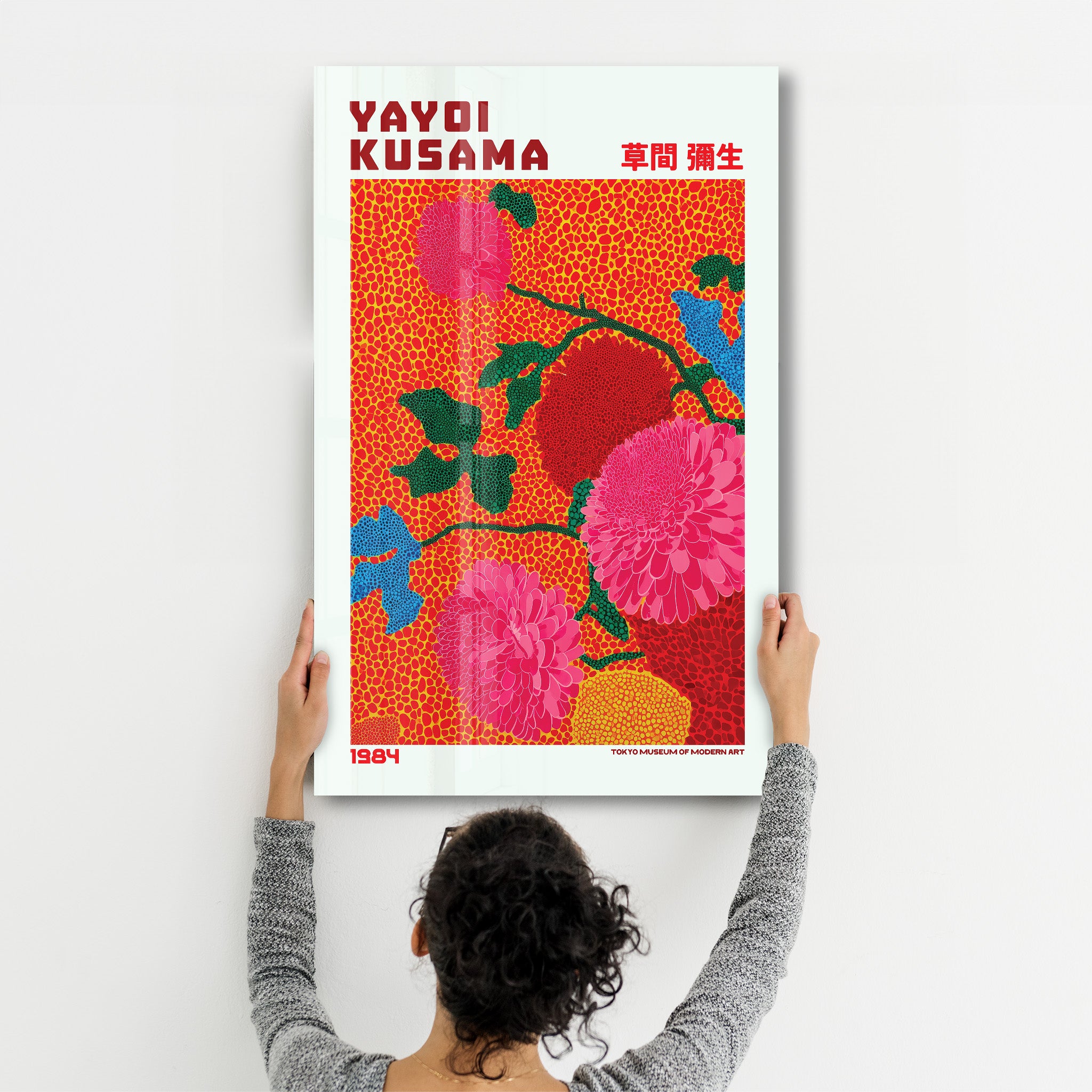 Glass wall art by Artdesigna featuring Yayoi Kusama's Scarlet Bloom Garden (1984) with vibrant red floral patterns on clear glass.
