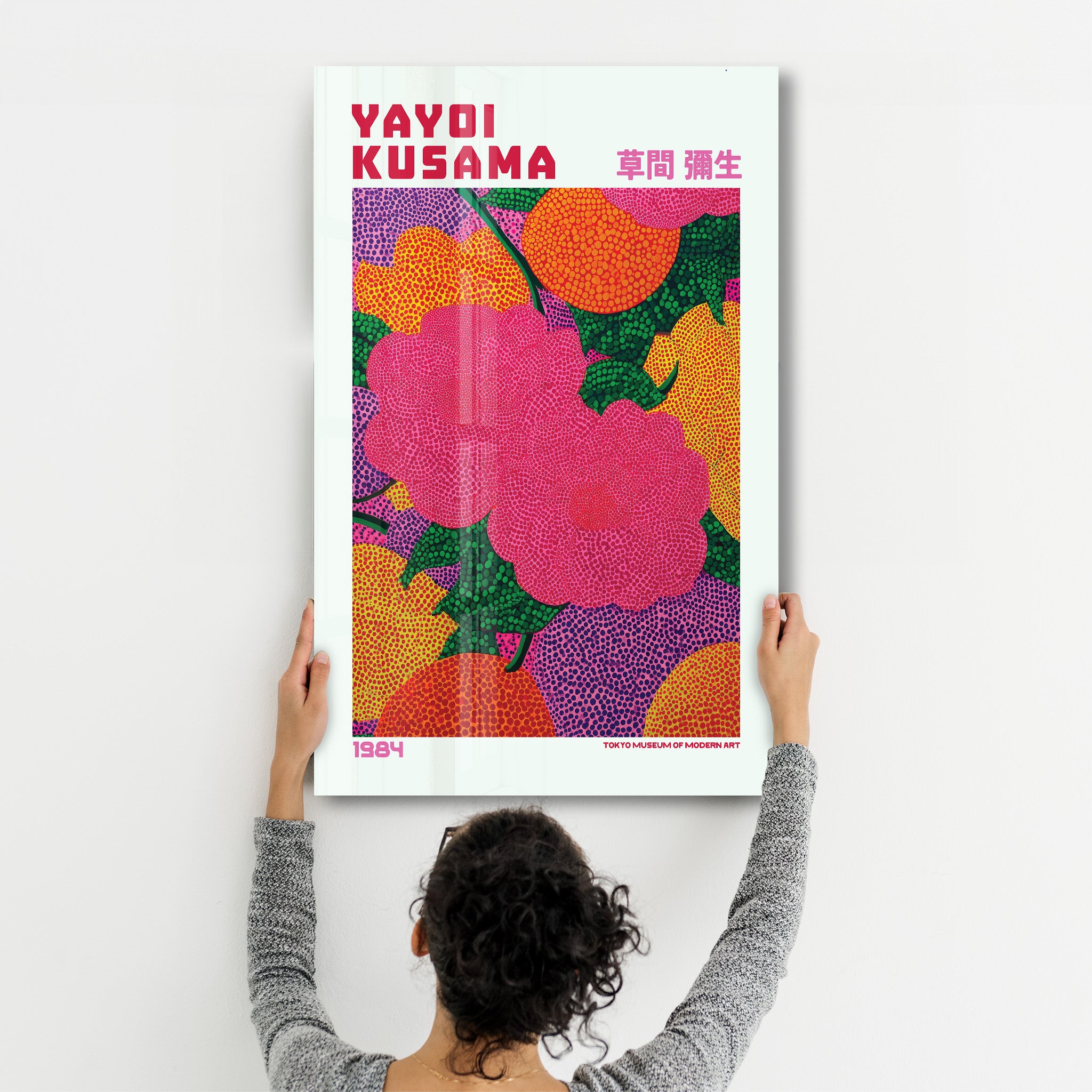 Pink Reverie glass wall art by Yayoi Kusama from Artdesigna, featuring vibrant pink abstract patterns on clear glass.