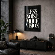 Artdesigna Less Noise, More Vision glass wall art displayed in a corner setting