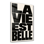 La Vie Est Belle glass wall art by Artdesigna, featuring elegant typographic design on glass panel