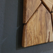 Handmade olive wood geometric wall sculpture by Artdesigna, featuring intricate wooden geometric shapes for modern wall decor.